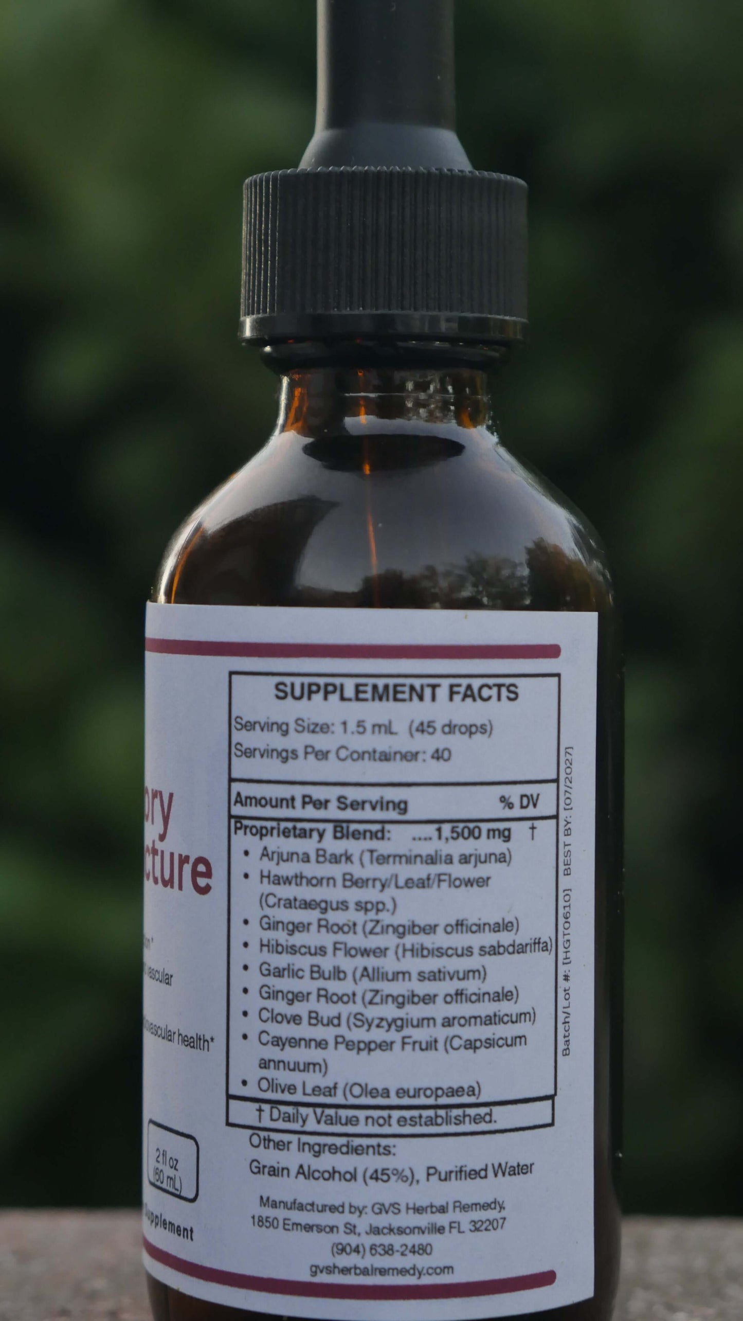 Supplement bottle with label showing supplement facts on a blurred background