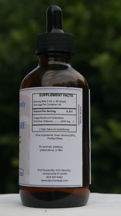 Chaga Tincture with a label on a blurred green background